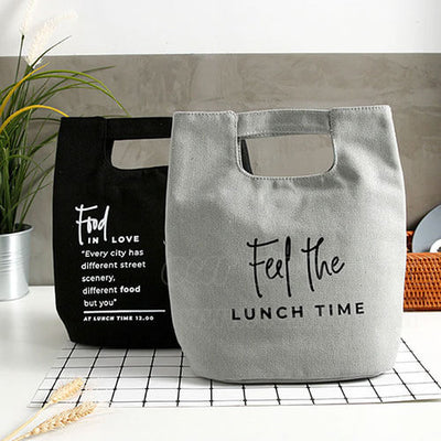 blue and gray canvas women lunch bag for work on desk